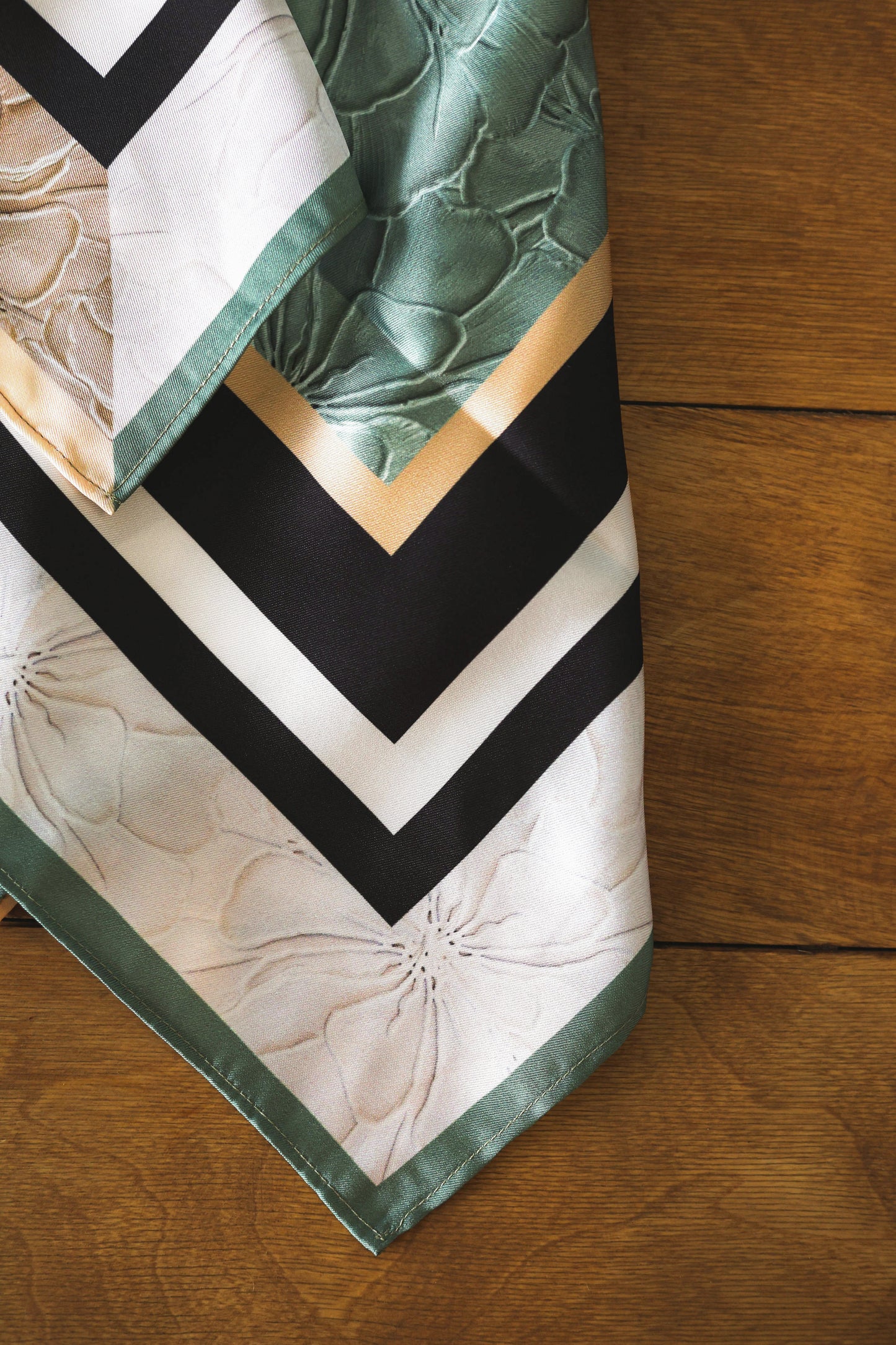 Scarf with a pattern on a wooden surface