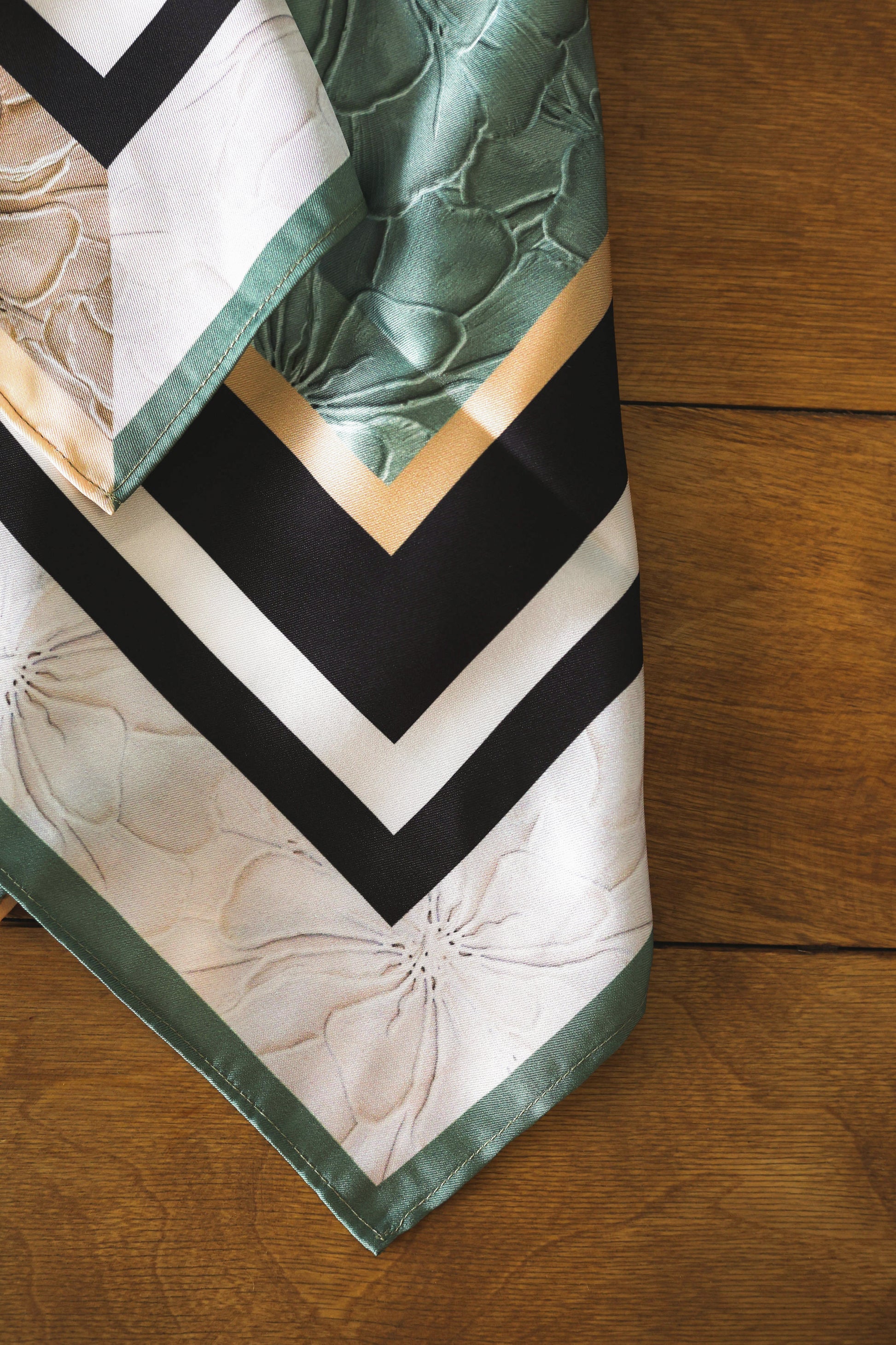 Scarf with a pattern on a wooden surface